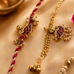 Maroon Meenakari Paisley Rakhi Set with Pearl Jhumki for Brother