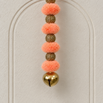 Peach Pom-Pom Bell Hanging - detail view