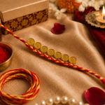 Traditional Gold Coin Rakhi with Red Mauli Thread for Brother - image 1