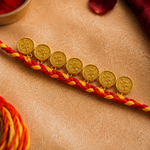 Traditional Gold Coin Rakhi with Red Mauli Thread for Brother - image 2