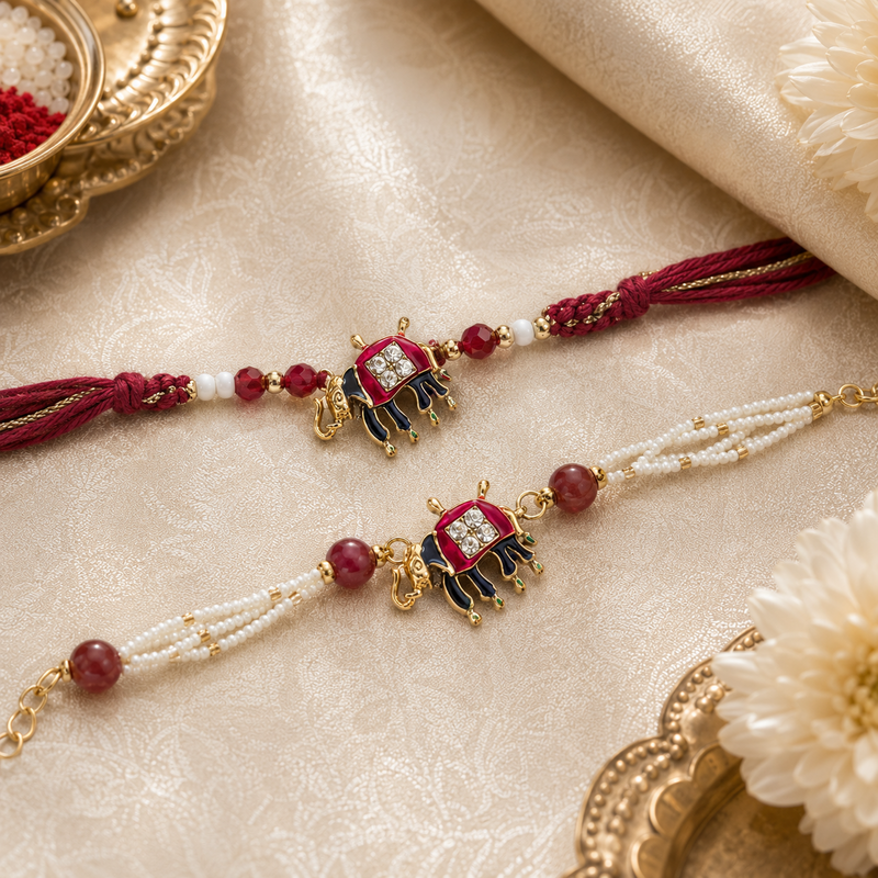 Royal maroon elephant motif Rakhi and pearl bracelet set - close-up