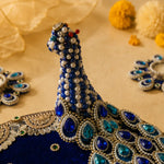 Close-up of the raised peacock detailing